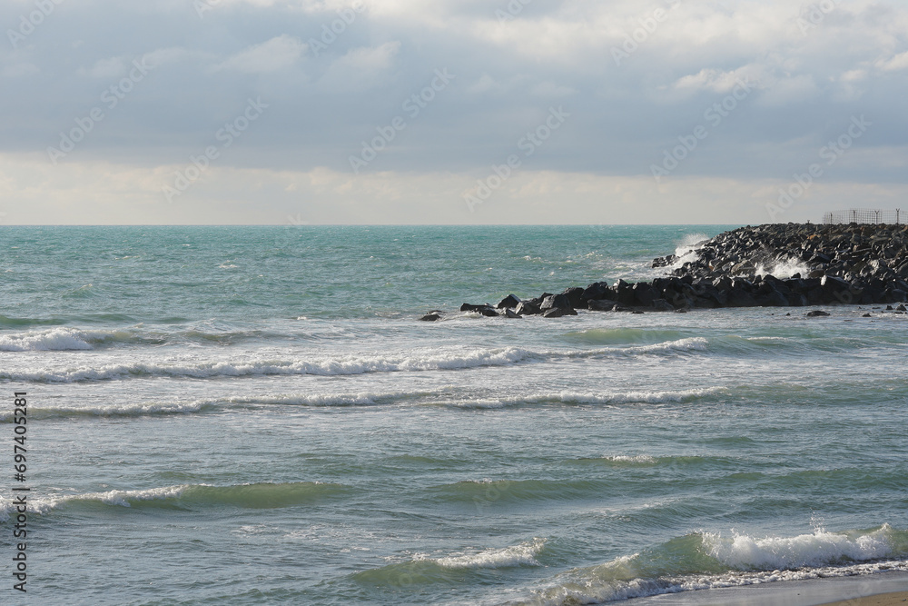 Ocean waves crashing over coastal sea rocks. High quality photo Ocean waves crashing over coastal sea rocks. High quality photo