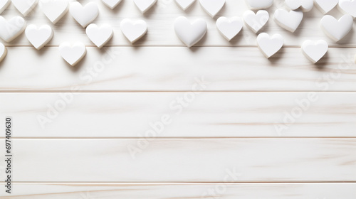 Valentine's day background. White hearts on wooden background. photo