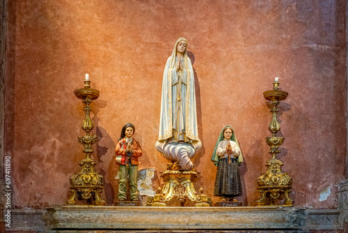 religious figures of saints of the catholic church, our lady of Fatima, santo Francisco Marto, santa Jacinta Marto, whith prayer.lisbon