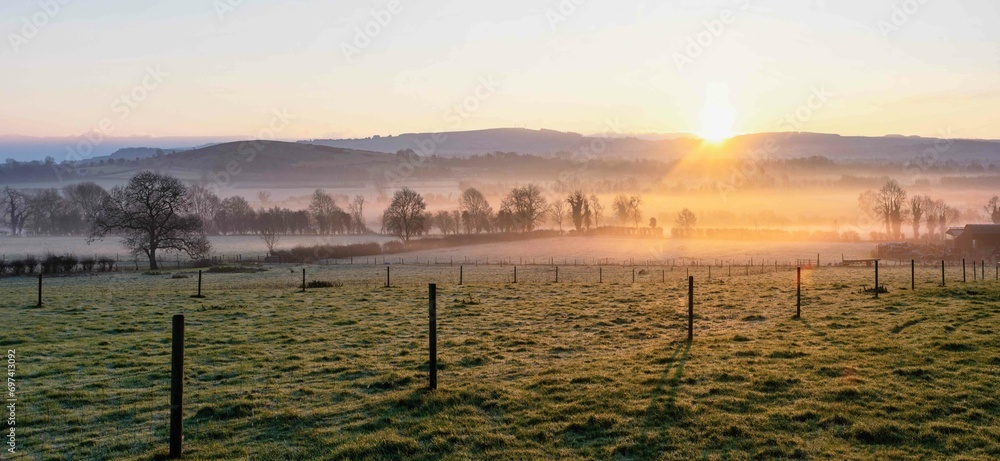 Beautiful Foggy Sunrise at Farm in Ireland Beautiful Foggy Sunrise at Farm in Ireland