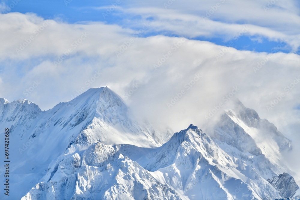 Snowcapped mountain by winter in French alps. 