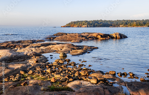 rocks on shoreline leading out into Georgian bay at Killarney Ontario photo