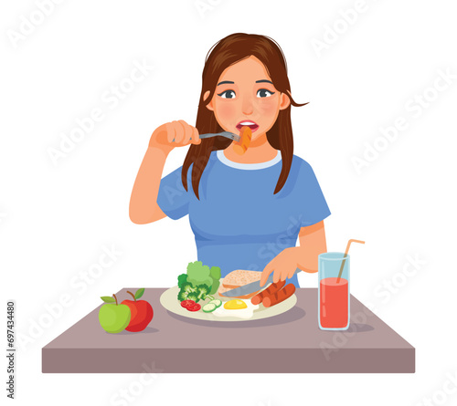 Young woman eating sausage eggs bread and vegetables for breakfast
