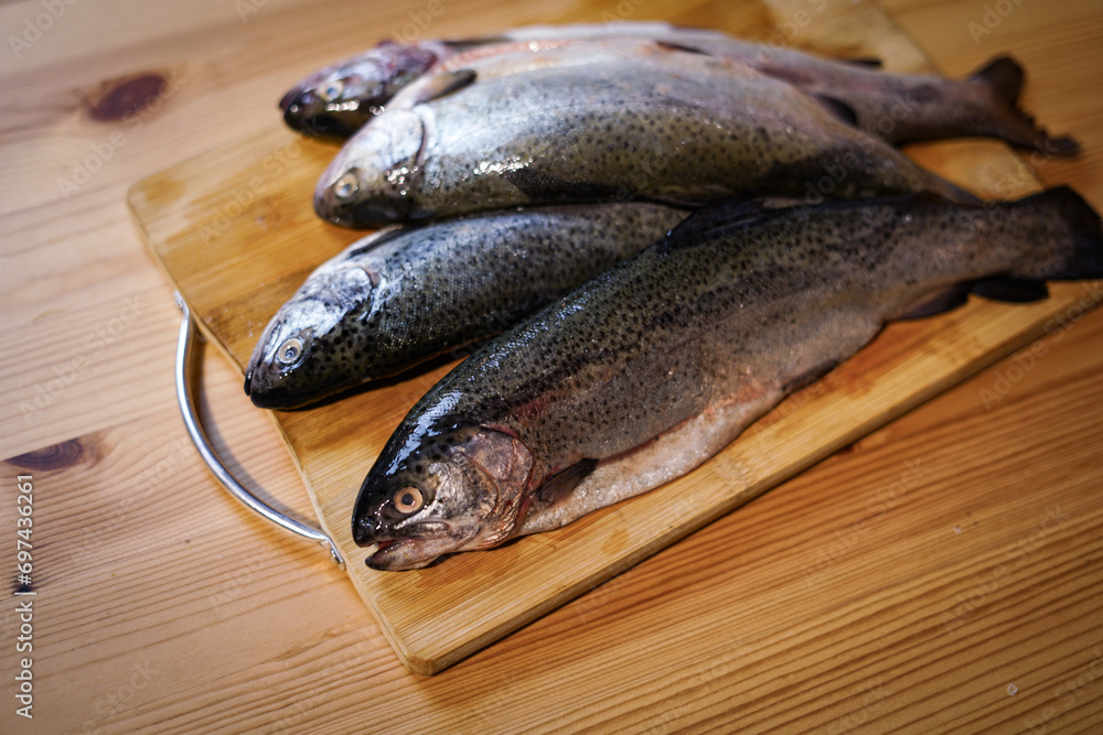 Fresh trouts on the wooden board. Fresh trouts on the wooden board.