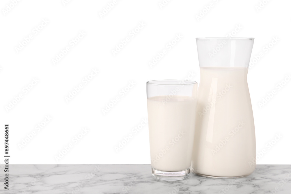 Glassware with tasty milk on marble table against white background Glassware with tasty milk on marble table against white background
