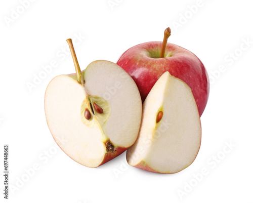 Whole and cut red apples isolated on white