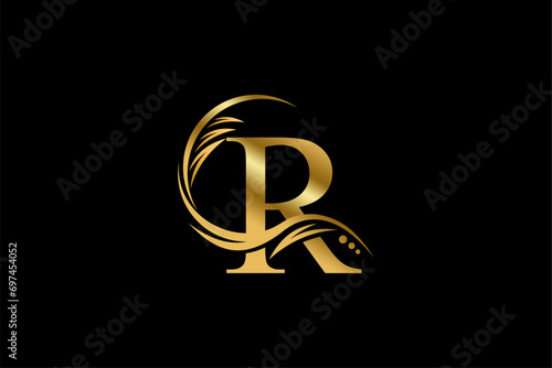 Gold letter R logo design with beautiful leaf, flower and feather ornaments. initial letter R. monogram R flourish. suitable for logos for boutiques, businesses, companies, beauty, offices, spas, etc photo