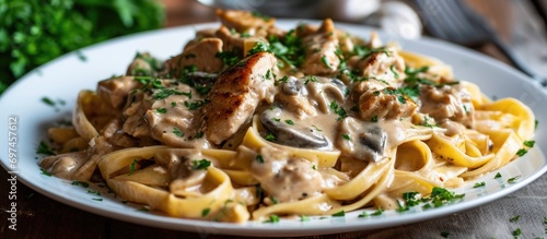 Creamy Chicken Marsala Pasta with Parsley, homemade on a plate.