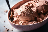 A chocolate ice cream with a scoop with creamy texture on pastel background, Overhead shot, created with Generative AI