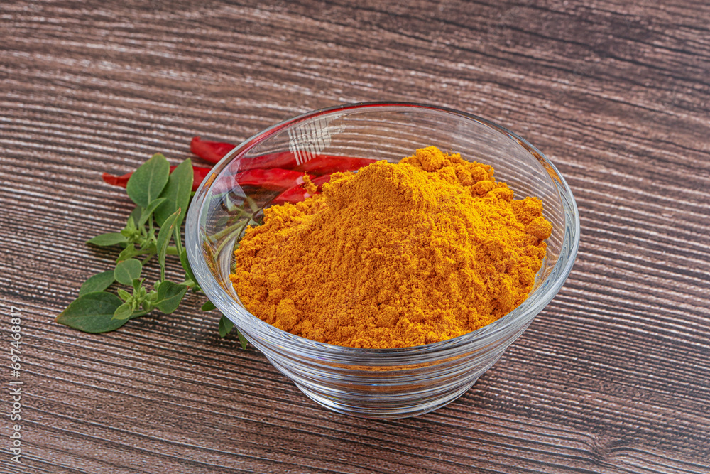 Yellow vibrant curcuma powder in the bowl Yellow vibrant curcuma powder in the bowl