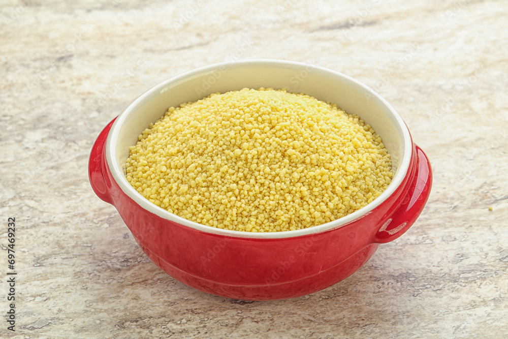 Raw couscous in the bowl Raw couscous in the bowl