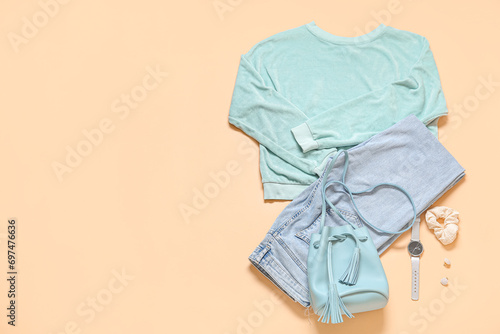 Set of stylish female clothes and accessories on color background © Pixel-Shot