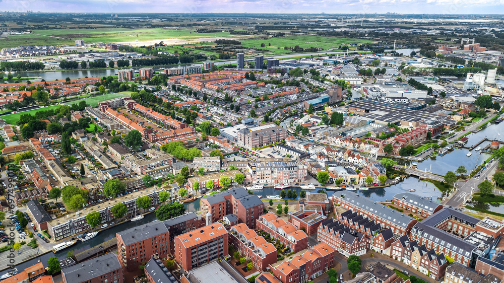 Aerial drone view of Gauda town cityscape from above, typical Dutch city skyline with canals and houses, Holland, Netherlands
