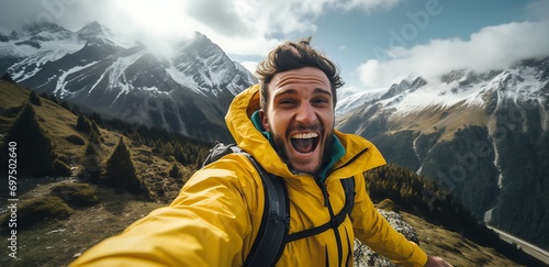 Joyful Man taking a selfie in the mountain. landscape view