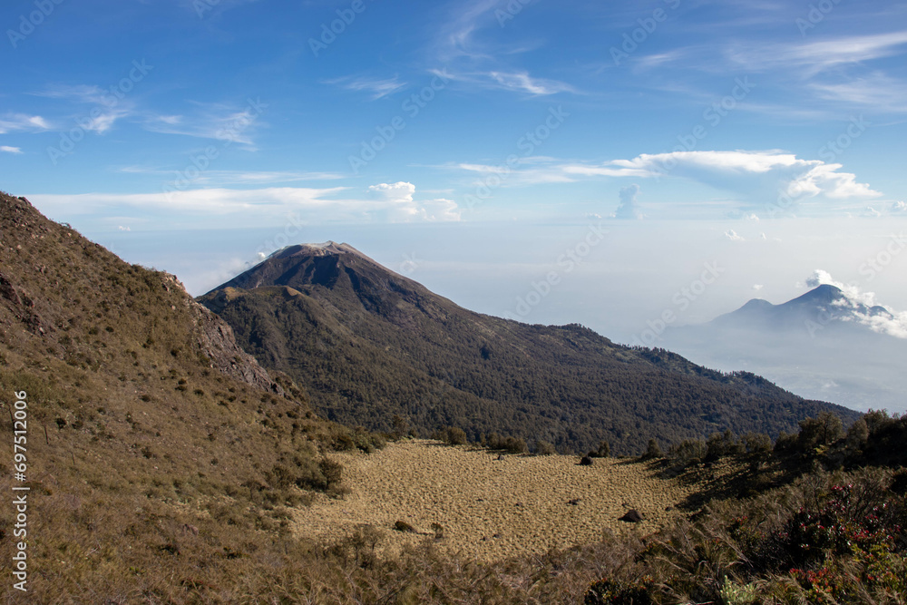 the beauty of the view at the top of a mountain in a tropical area is like a country above the clouds. a view presented when climbing an Indonesian mountain.