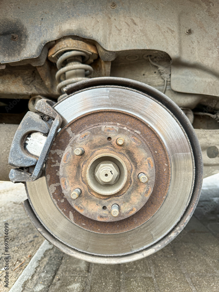 A brake disc on a removed car wheel