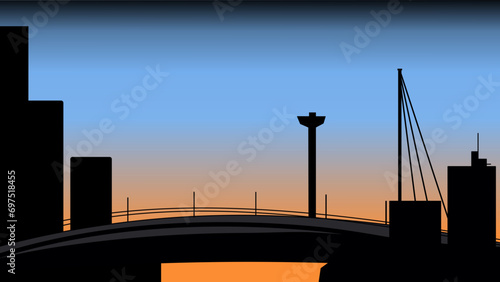 Silhouette of a city landscape that thrives on transportation and technology, during sunrise time