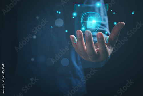 Cybersecurity, and privacy technology to the future concept. Businessman holding a lock on hand, protections personal data from attack cyber, and hacker. Technology cybersecurity.