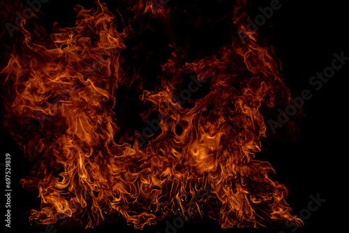 Fire blaze flames on black background. Fire burn flame isolated, abstract texture. Flaming explosion effect with burning fire. photo