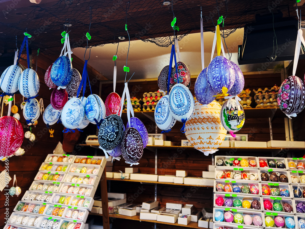 Hanging Easter eggs on ribbon under the roof of a market stall, an example of home decoration