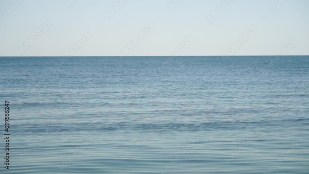 Aerial panoramic view of beautiful sunset above sea. Beautiful seascape. Sun glare, small waves on the water surface. Evening. Horizon. Nobody. No people. Never-ending beauty of nature. Aerial panoramic view of beautiful sunset above sea. Beautiful seascape. Sun glare, small waves on the water surface. Evening. Horizon. Nobody. No people. Never-ending beauty of nature.