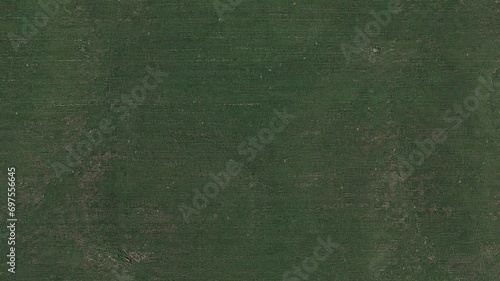 Billede på lærred Perpendicular aerial view of a green grass field for architectural landscape des