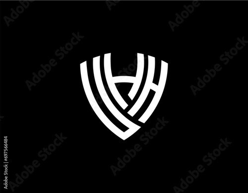 UHH creative letter shield logo design vector icon illustration photo