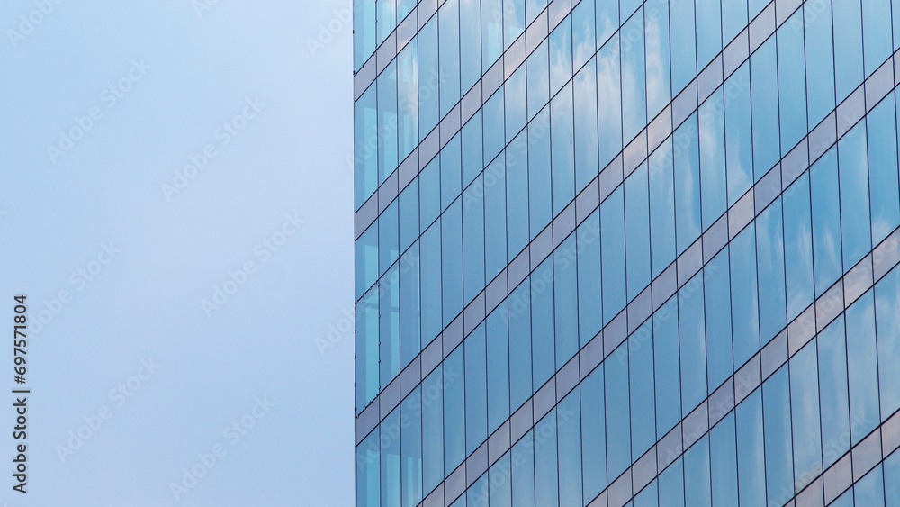 Abstract architecture background, minimalist top of building detail against blue sky for use as art, background or copyspace Abstract architecture background, minimalist top of building detail against blue sky for use as art, background or copyspace