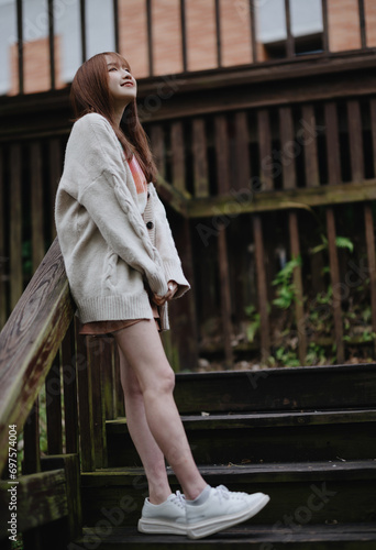 portrait of an asian young woman aty the park photo