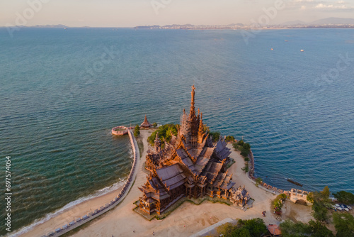 Wooden temple by the ocean of Pattaya  The Sanctuary of Truth wooden temple in Pattaya Thailand is a gigantic wooden construction located at the cape of Naklua Pattaya City Chonburi Thailand