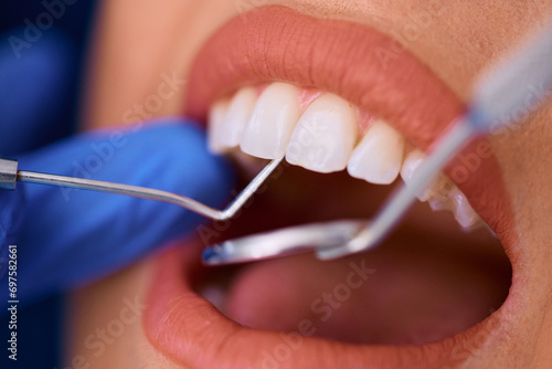 Close up of woman having dental exam at dentist's office.