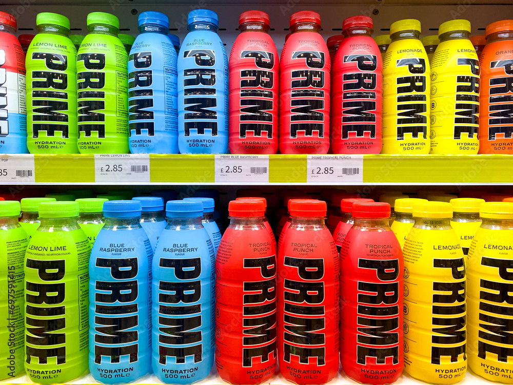 Bottles of Prime sports and energy drink displayed on shelves in a shop