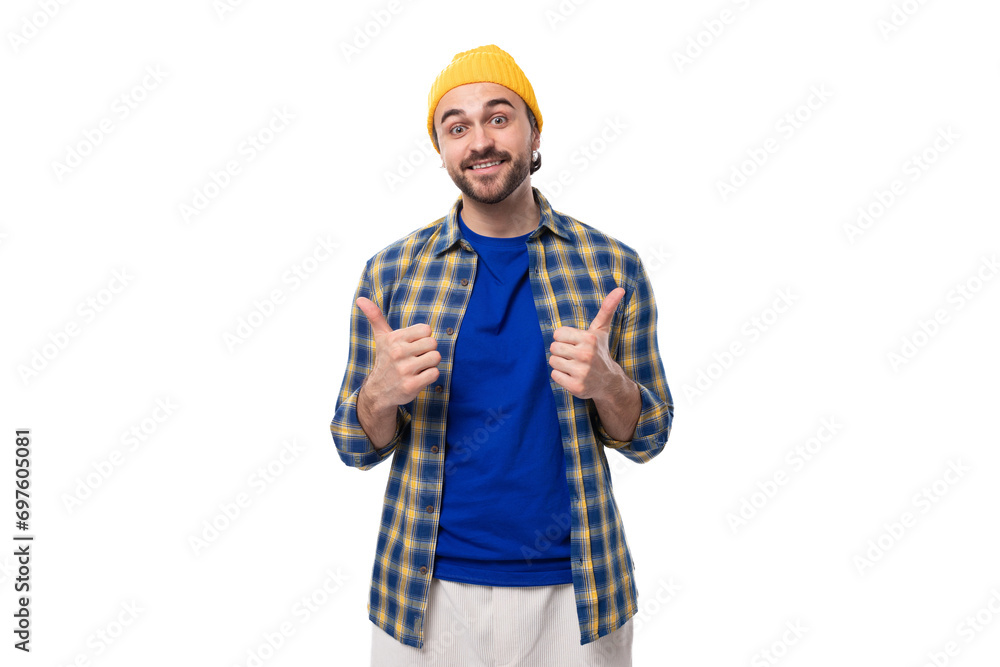 cute charming young hipster man in yellow cap and shirt on white background with copy space cute charming young hipster man in yellow cap and shirt on white background with copy space