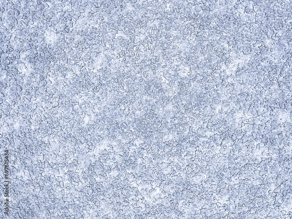 Fototapeta premium Winter abstract background. Snowflake pattern on a blue background. Macro texture. Natural background. View from above. 