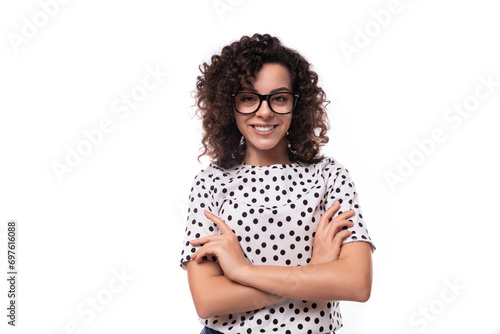 young stylish caucasian woman with curly perm hair looks happy and confident photo