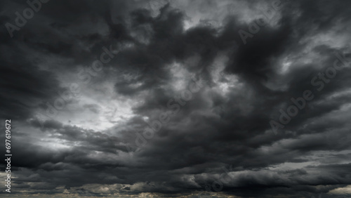 Obraz na płótnie dark dramatic sky with black stormy clouds before rain or snow as abstract backg