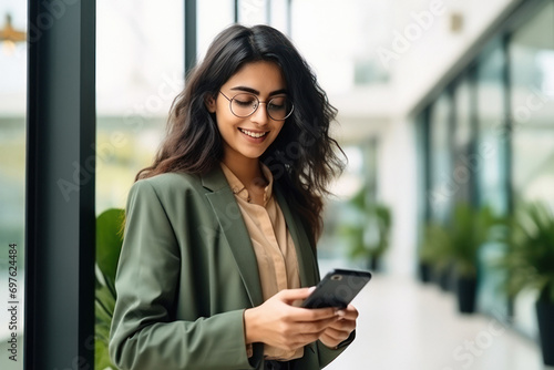 Young businesswoman using smartphone photo