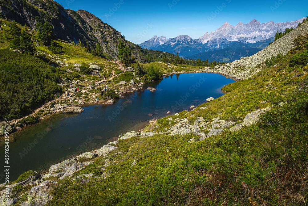Amazing mountain lake and high snowy peaks in Austria