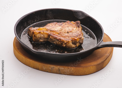 Angus steak fried on vegetable oil on iron cast