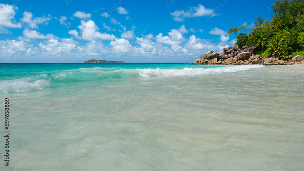 Palm and tropical beach panorama. Anse Lazio beach at Praslin island, Seychelles, long exposure, vintage toning