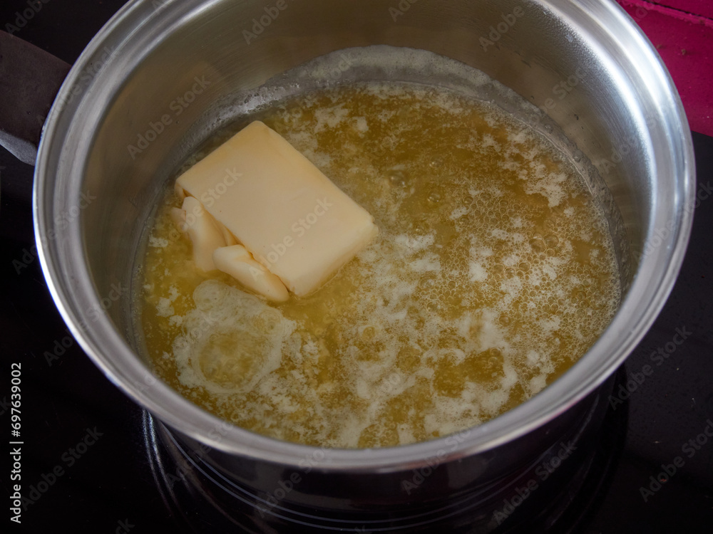 Butter a casserole to be melted and used in a cheesecake recipe Butter a casserole to be melted and used in a cheesecake recipe