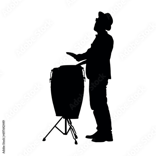 Musician hitting playing conga drum side view black silhouette. photo