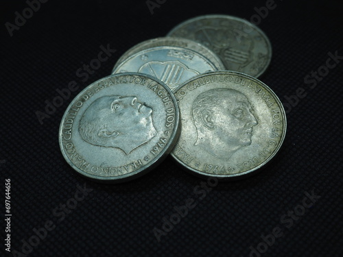 Silver coins of 100 pesetas featuring Francisco Franco, the Caudillo.