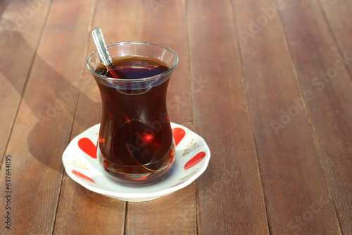 turkish black tea in traditonal tea glass photo