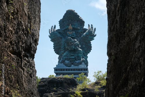 Statue of Patung Garuda Wisnu Kencana on sunny day. Garuda Wisnu Kencana Cultural Park, Bali, Indonesia.