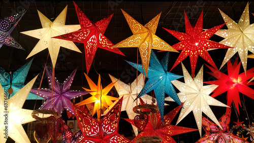 Herrnhut stars, bright colorful decoration at the Christmas market, star shaped lamp photo
