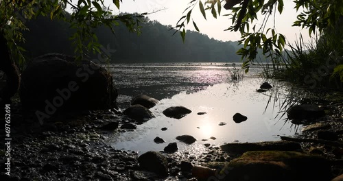 river,   water with waves in the river withtrees  on the river bank photo