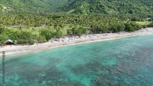 Sentigi Beach, located in Senggigi, West Lombok. Beautiful beach with clear water and green coral photo