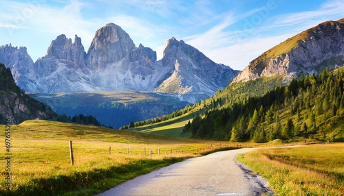 empty country road on venegia valley high altitude dolomite valley natural park with jagged peaks rolling meadows pastures and streams stunning morning scene of italian countryside © Ashley