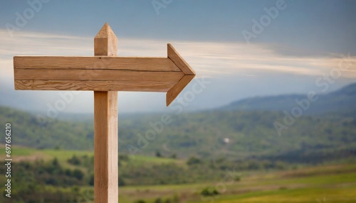 wooden arrow sign post or road signpost isolated photo